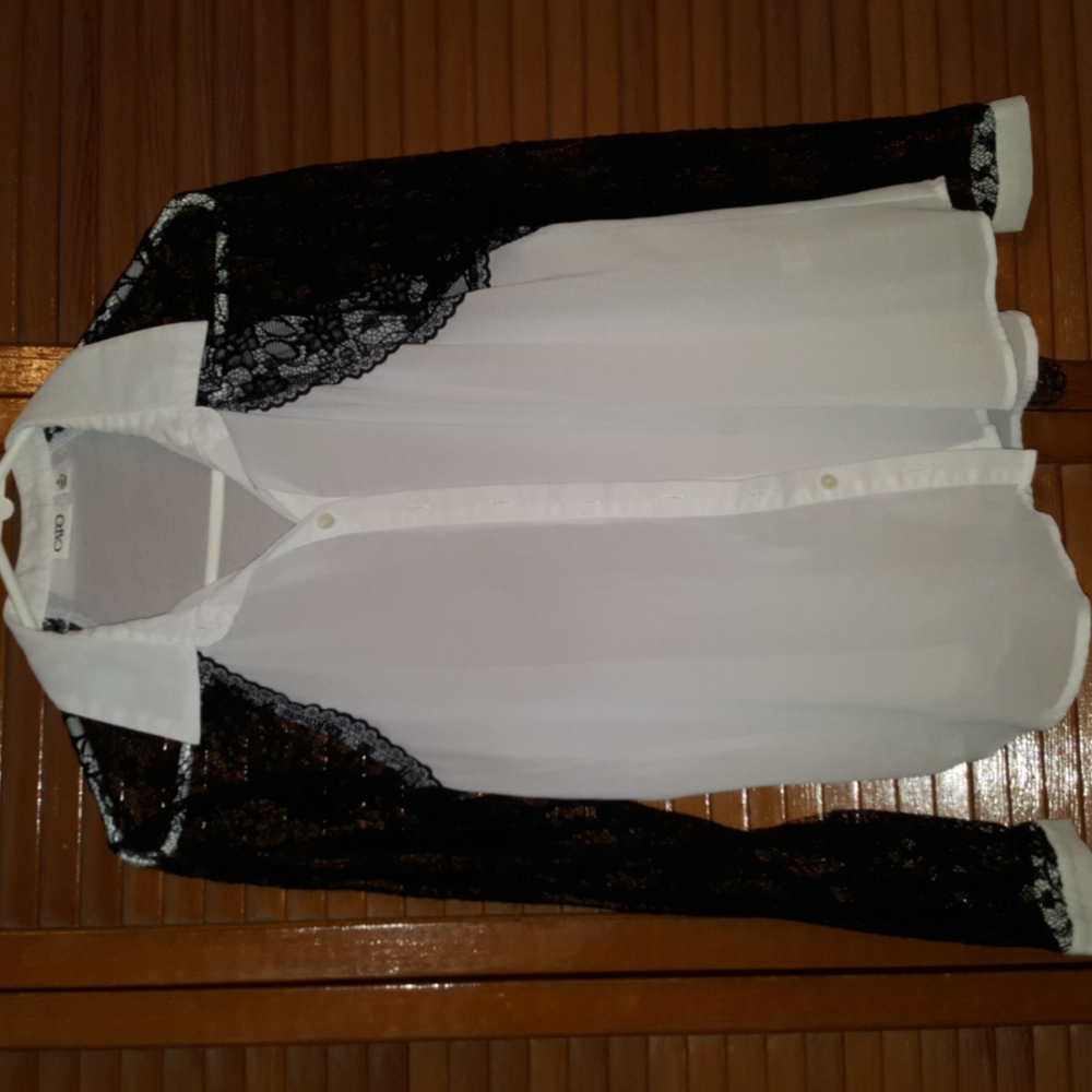 See thru off white with black lace sleeves